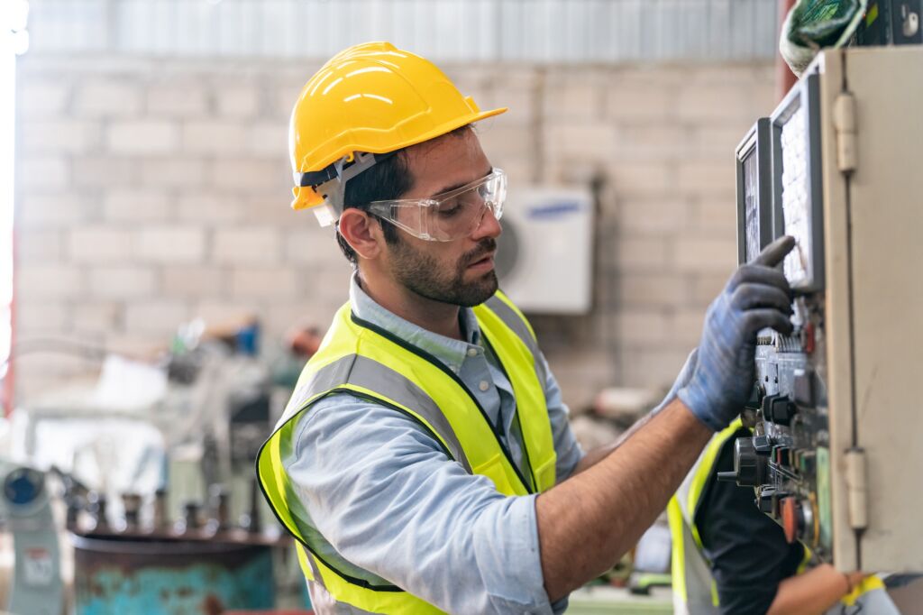 Business industry technology, people and tech. Engineer working maintenance in factory warehouse