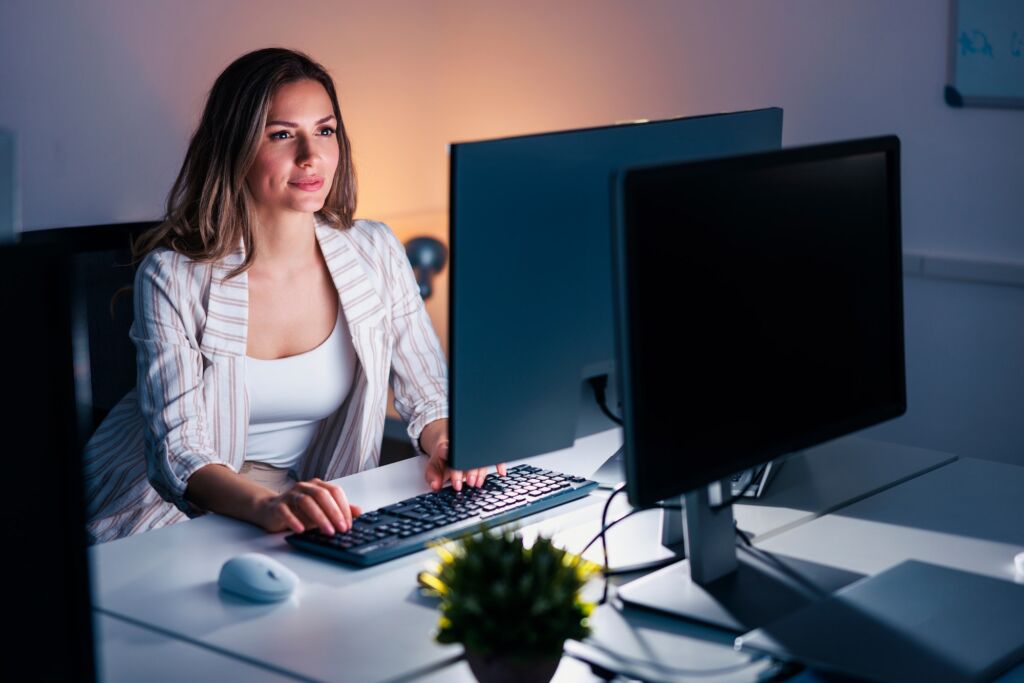 Female programmer working late in the office