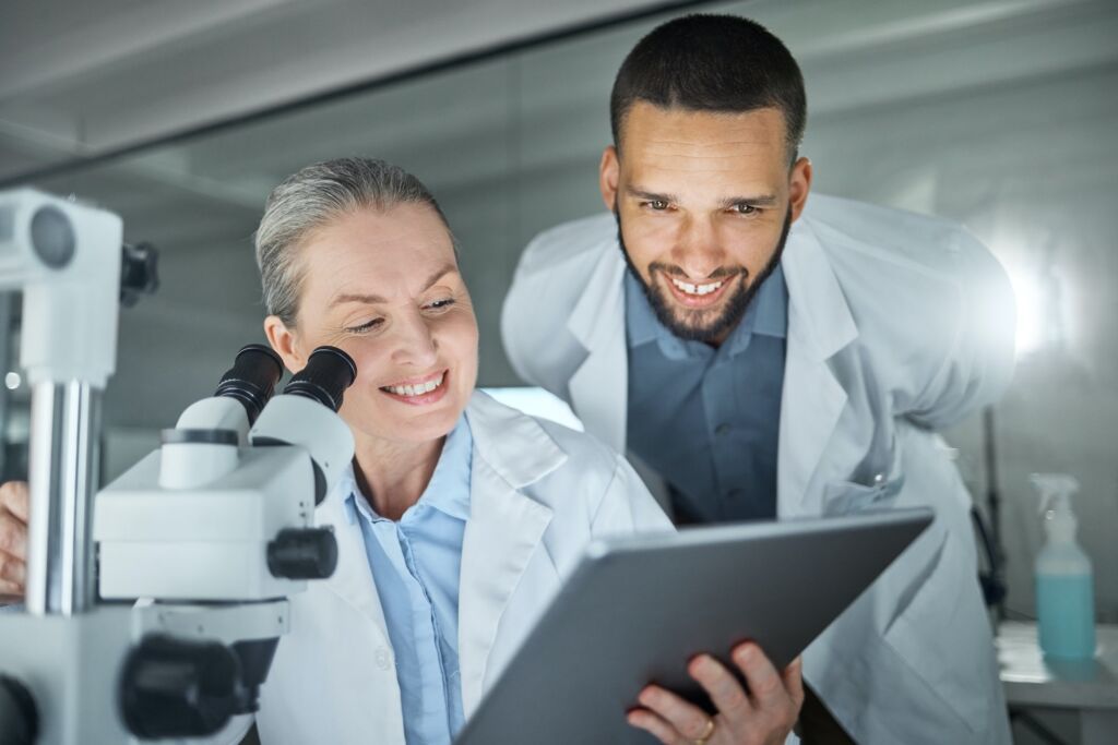 Laboratory collaboration, microscope or tablet in science data analysis, medical innovation help or